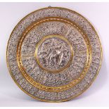 A LATE 19TH CENTURY INDIAN TANJORE SILVER AND COPPER EMBOSSED BRASS TRAY/PLAQUE, decorated with