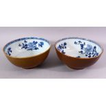 A PAIR OF CHINESE NANKING CARGO SHIPWRECK BOWLS, the interior with blue and white floral decoration,