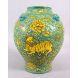 A CHINESE MING STYLE TURQUOISE GROUND PORCELAIN KYLIN VASE, decorated with a turquoise ground with