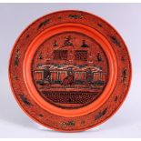 A 19TH / 20TH CENTURY INDIAN LACQUER PLATE, with scenes of figures and buildings, 26cm