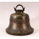 A TIBETAN CAST BRONZE TEMPLE BELL, with a band of calligraphy to the exterior and a possible