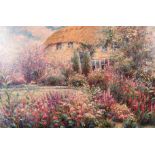 G. Sherman (20th century) A country garden in full bloom with a thatched cottage beyond, oil on