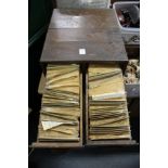 A four drawer index chest containing numerous stamps, together with a box of stamps and other