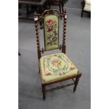 A Victorian rosewood and needlework upholstered occasional chair.