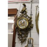 A large decorative rococo style wall clock.