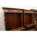 A pair of Sheraton revival inlaid mahogany open bookcases.