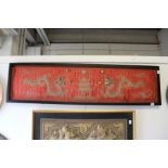 A Chinese metal thread embroidered picture depicting two dragons chasing the pearl of wisdom,