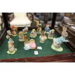 Beatrix Potter figures to include a large Beswick Peter Rabbit, nine small Beswick figures and two
