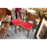 A set of eight mahogany dining chairs, two with arms.