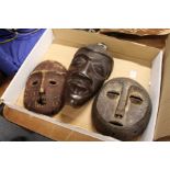 Three wooden masks.