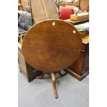 A George III mahogany circular tilt top tripod table.