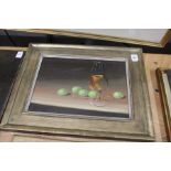 A still life of wine glass and grapes, oil on board, in a gilt frame.