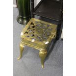 A polished brass footman / stand.