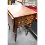 A 19th century mahogany two drawer drop leaf work table (lacking basket).