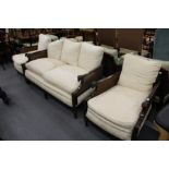 A very good Bergere three piece suite, double caned, comprising a large two seater settee and a pair