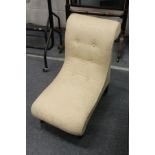 An upholstered small bedroom chair.
