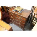 A George III mahogany bachelor's chest with brushing slide, two short and three graduated long