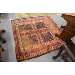 A Turkoman rug, red ground with four panels.