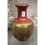 A Japanese vase, red ground with gilt decoration.