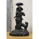 A cast iron door stop modelled as a hunter and dog.