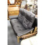 A good Stressless beech framed black leather upholstered high back reclining two seater settee.