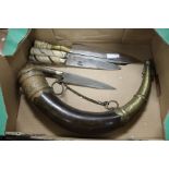 A powder horn and four knives.