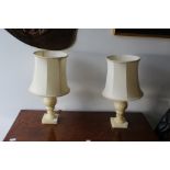 A pair of alabaster table lamps.
