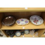 Two floral decorated dishes and a plated bowl.