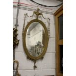 A decorative gilt framed mirror.