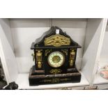 A large Victorian slate mantle clock.