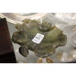 A carved jade leaf shaped brush washer.