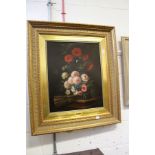 J. Gonzales, a good still life of flowers in a vase on a ledge, in a good decorative gilt frame.