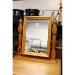 A pine dressing table mirror.