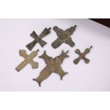 A small bag of early bronze crosses.