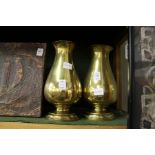 A pair of heavy brass baluster shaped vases.