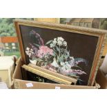A small group of oil paintings depicting floral subjects and other pictures.
