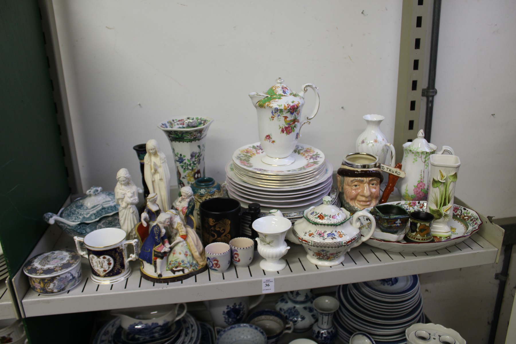 A shelf of decorative china.