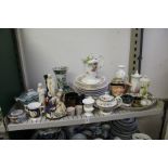 A shelf of decorative china.