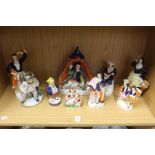 A group of Staffordshire figures.