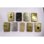 Various Zippo and similar cigarette lighters.