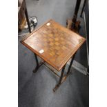 A mahogany and yew wood occasional gaming table with fern inlaid decoration.