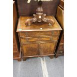 A walnut chest with two drawers and a pair of cupboard doors.