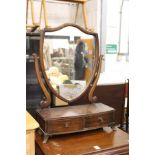 A dressing table mirror.