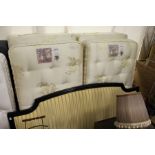 A king size bed with a pair of Staples Mozart mattresses on box bases together with a striped