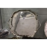 A silver twin handled square shaped salver with pie crust border, Sheffield 1901, 26ozs.