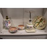 A quantity of Poole pottery and similar china to include lamp bases and bowls.