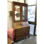 A good George III mahogany bureau bookcase, the upper section with a pair of mirrored doors.