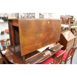 A mahogany drop leaf gate leg dining table.