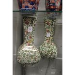 A pair of Royal Doulton Persian ware vases.