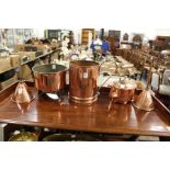 A collection of five copper items to include a kettle, two funnels etc.